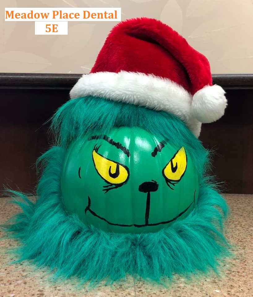 Pumpkin decorated to look like the Grinch